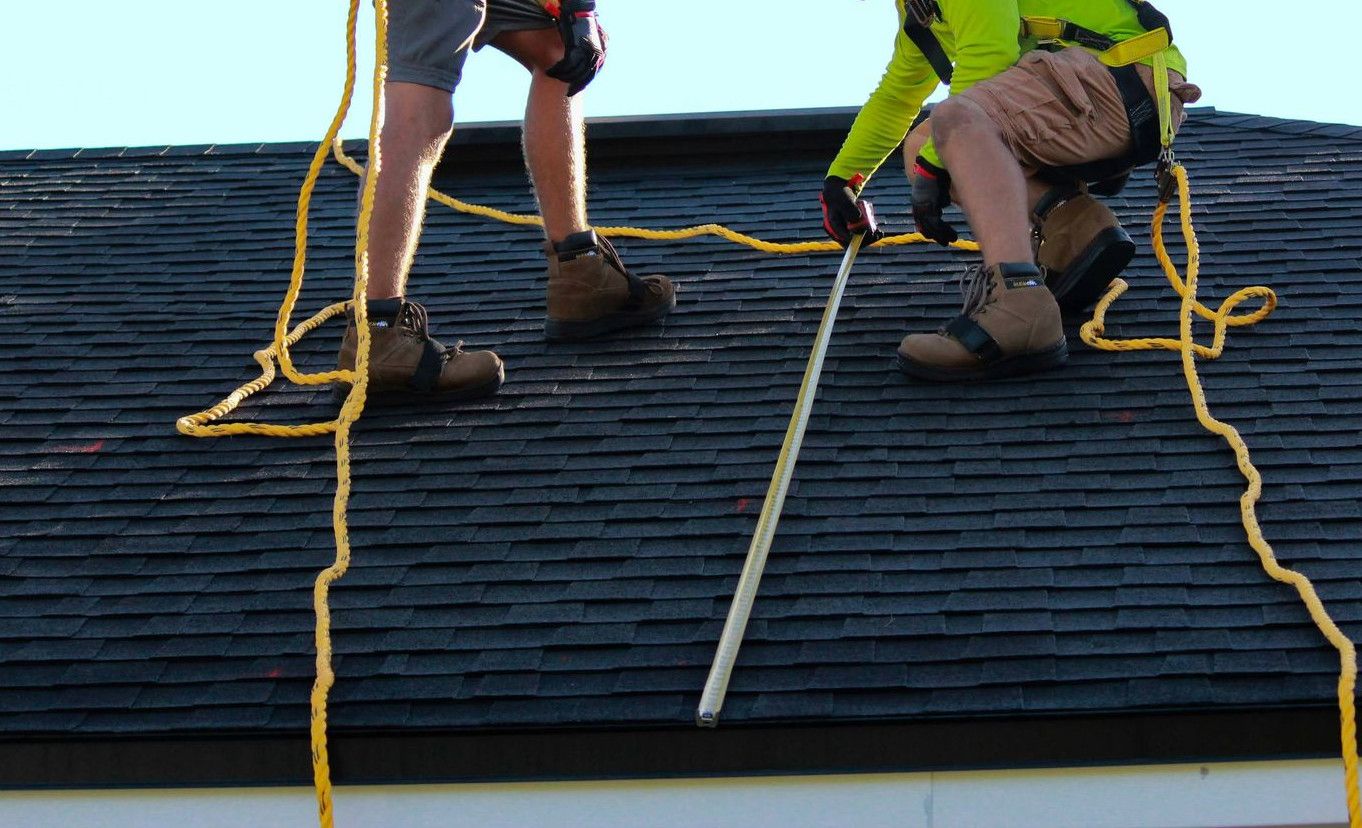 a couple of people that are on a roof